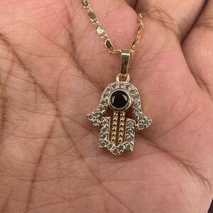 Gold Hamsa Pendant Necklace with Black Stone